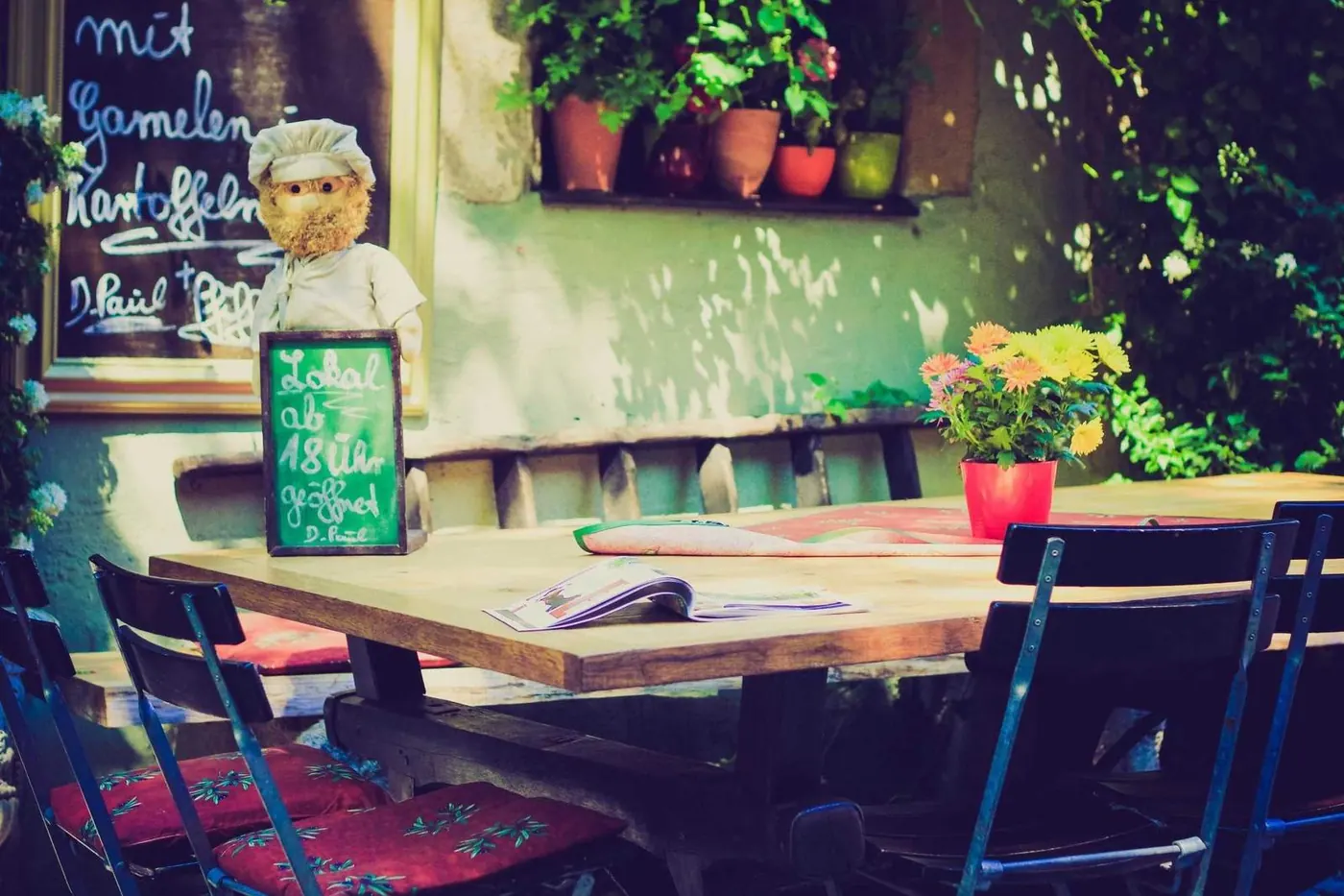 Outdoor terrace tables with blue chairs